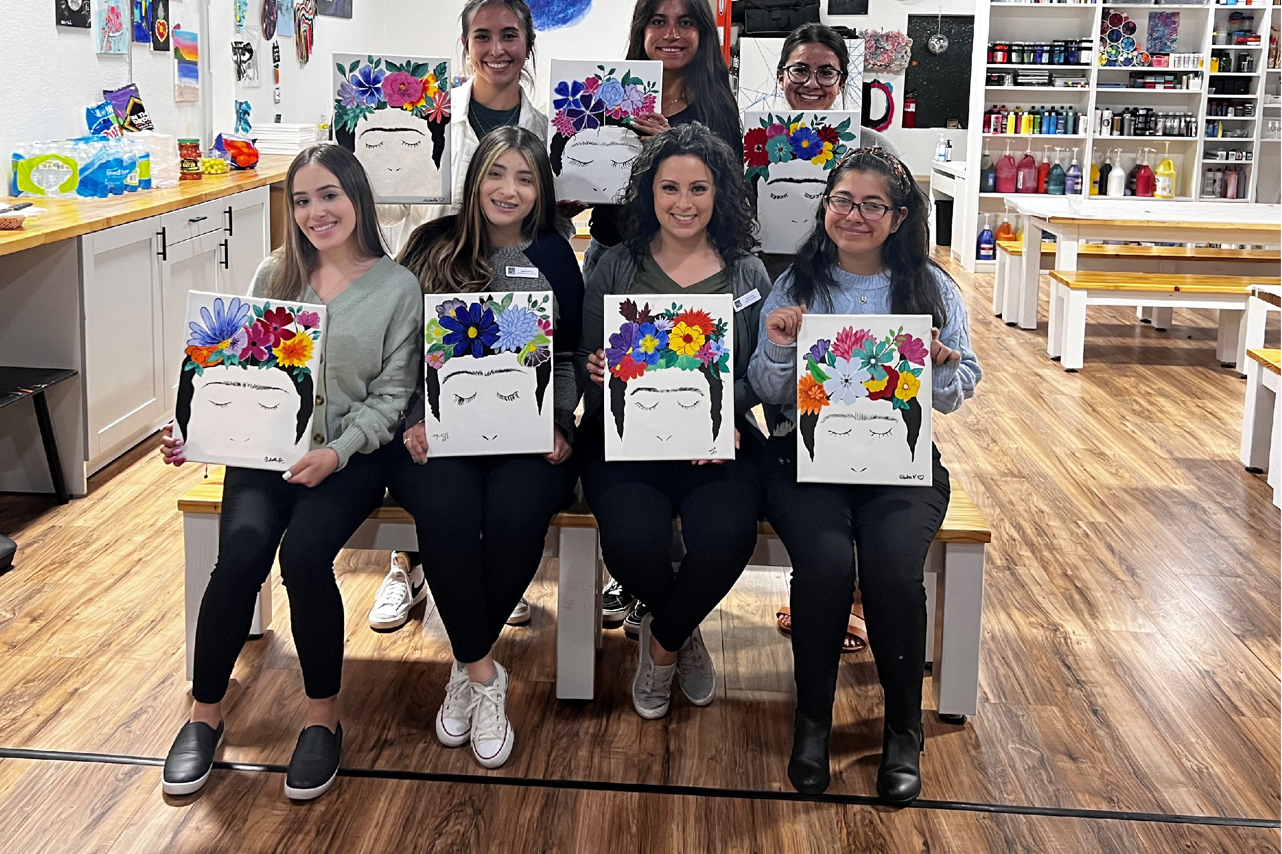 Group of individuals who attending the Blueprint Art Studio event and painted Frieda