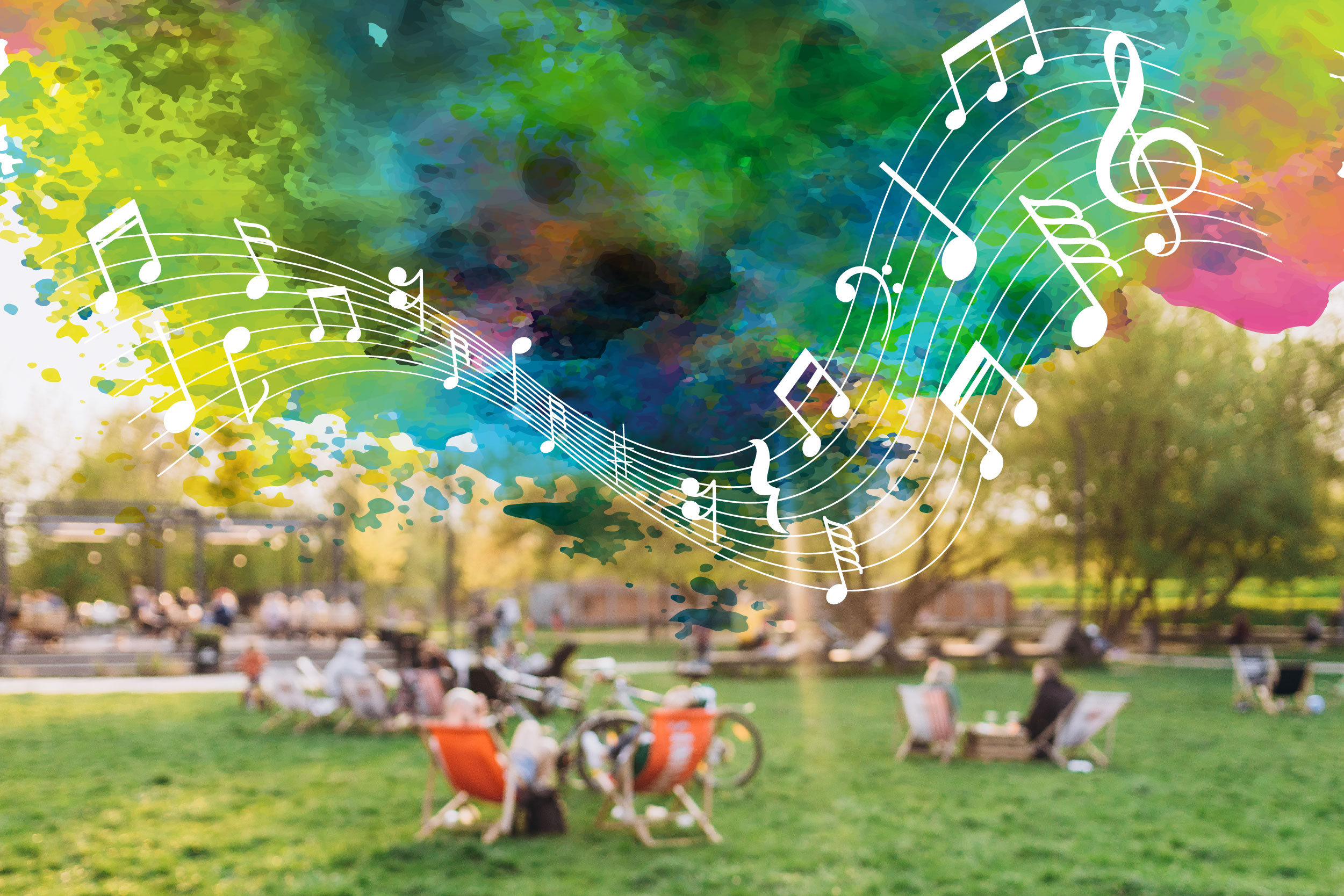 Group of individuals sitting in the grass with colorful music notes flowing in the sky.
