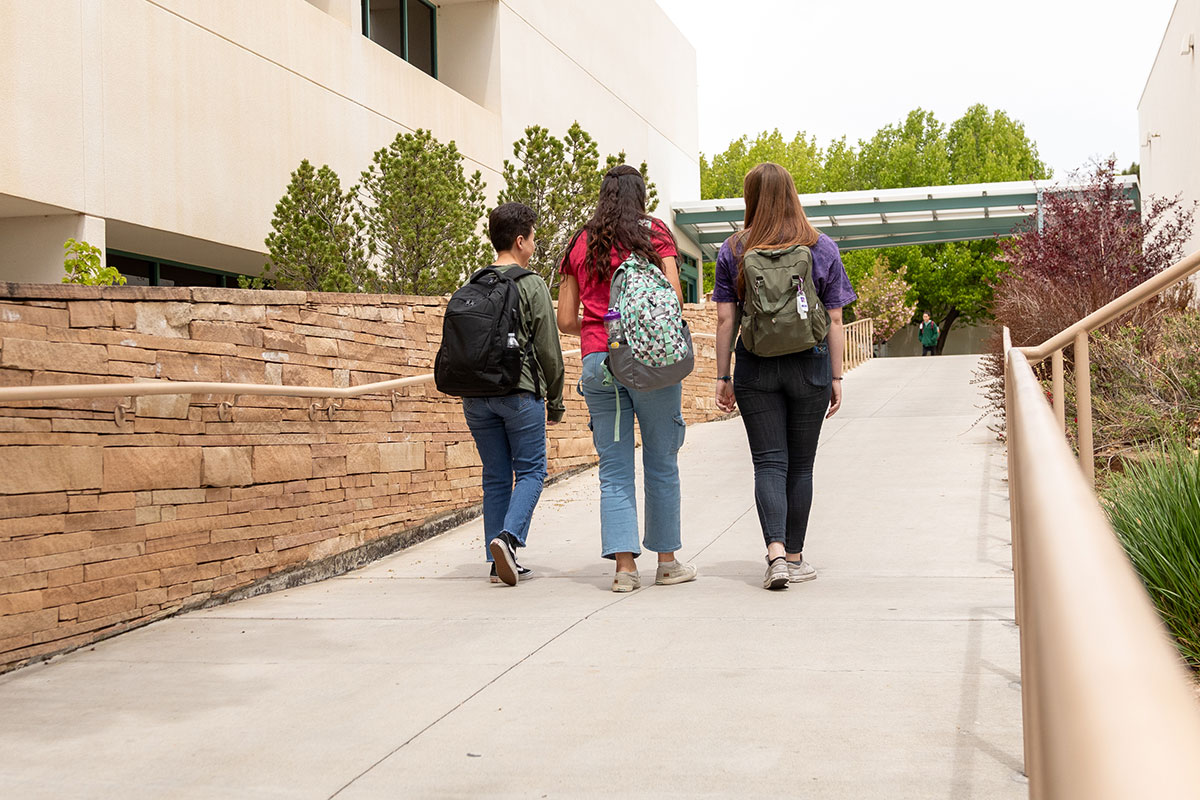 Three students walking on SJC Campus