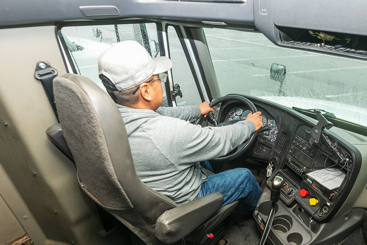 A San Juan College student in the cab of a large commercial truck