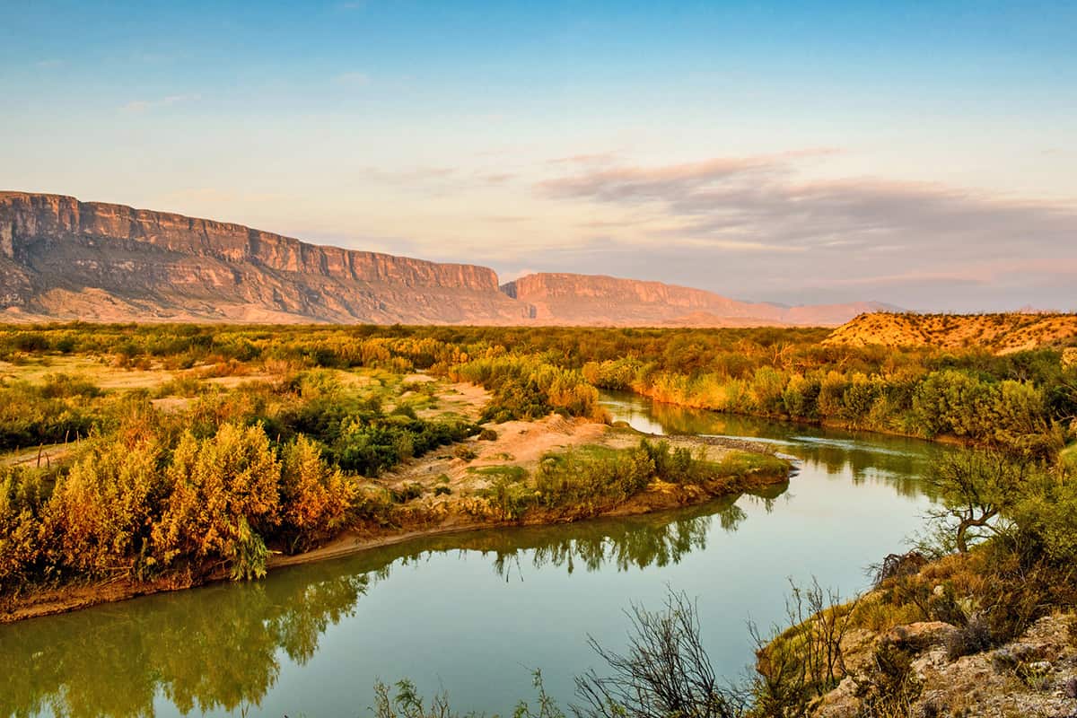 High desert landscape shows river and mountain ranges
