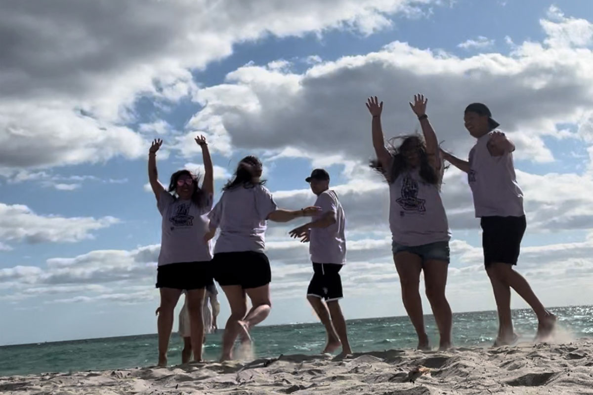 SJC TRIO Students in Miami jumping at  the beach